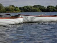 three rowing boats