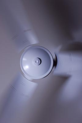 a modern white ceiling fan