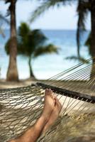 Man relaxing in a hammock