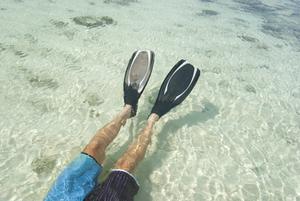 Man snorkeling in clear water
