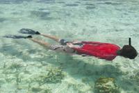 Person snorkeling in clear water