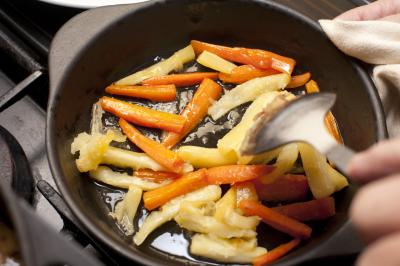 Carrot and parsnip batons being sauteed