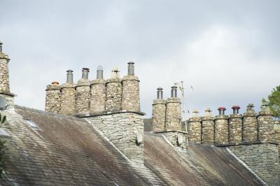 Traditional cylindrical stone chimney pots