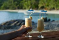 Man enjoying a tropical cocktail