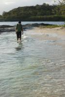 Man paddling in shallow surf