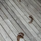 Wet footprints on a deck