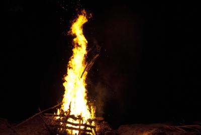 Towering flames above a bonfire