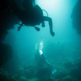Scuba divers cave diving
