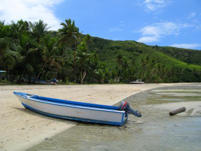 Wooden boat on a tropical island