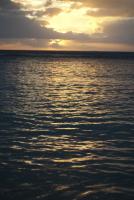 Glowing sunset over a still ocean