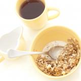 Bowl of muesli and coffee for breakfast