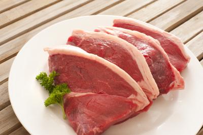 Four fresh raw beef steaks