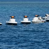 Jet skis moored in a line