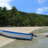 Wooden boat on a tropical island
