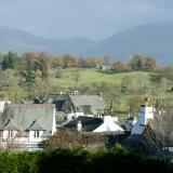 View over the rooftops of Hawkshead to Red Screes
