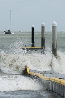 a jetty being smashed by a strom