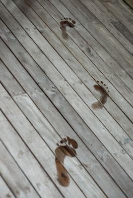 Wet footprints on a deck