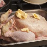 Uncooked turkey in a roasting pan
