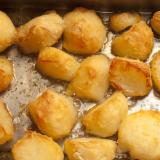 Background of delicious golden roast potatoes